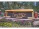 Toscana of Desert Ridge community sign with colorful flowers at 5350 E Deer Valley Dr # 2435, Phoenix, AZ 85054