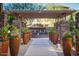 Scenic courtyard with elegant planters, pergola and calming water feature at 5350 E Deer Valley Dr # 2435, Phoenix, AZ 85054