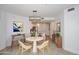 Bright dining area featuring modern lighting and adjacent breakfast bar to the kitchen at 5350 E Deer Valley Dr # 2435, Phoenix, AZ 85054