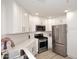 Clean kitchen featuring stainless steel appliances, white cabinetry, and light countertops at 5350 E Deer Valley Dr # 2435, Phoenix, AZ 85054