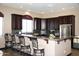 Kitchen bar with granite countertops, dark cabinetry, and stainless appliances at 5350 E Deer Valley Dr # 2435, Phoenix, AZ 85054