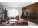 Cozy living room featuring a fireplace, comfortable seating, and ample natural light at 5350 E Deer Valley Dr # 2435, Phoenix, AZ 85054