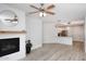 Spacious open-concept area features fireplace and kitchen, illuminated by natural light at 5350 E Deer Valley Dr # 2435, Phoenix, AZ 85054