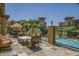 Outdoor patio with pool view, lounge seating, and desert landscaping at 5350 E Deer Valley Dr # 2435, Phoenix, AZ 85054