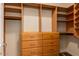 Spacious walk-in closet with shelving, drawers, and hanging rods for optimal storage organization at 5350 E Deer Valley Dr # 2435, Phoenix, AZ 85054