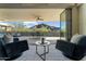 Indoor living space showcases a balcony with mountain views, creating a serene and inviting atmosphere at 5527 E Arroyo Verde Dr, Paradise Valley, AZ 85253