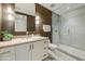 Stylish bathroom featuring a walk-in shower with glass door, sleek vanity, and contemporary lighting at 5527 E Arroyo Verde Dr, Paradise Valley, AZ 85253