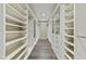 Spacious walk-in closet providing ample storage space with custom shelving and drawers at 5527 E Arroyo Verde Dr, Paradise Valley, AZ 85253