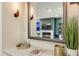 Entryway display with decor, magazine, and mirror that reflects the living room at 5527 E Arroyo Verde Dr, Paradise Valley, AZ 85253