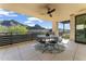 Spacious patio featuring a dining area, ceiling fan, and mountain views, ideal for outdoor entertaining at 5527 E Arroyo Verde Dr, Paradise Valley, AZ 85253