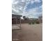 Spacious backyard featuring a covered patio, perfect for relaxing and enjoying the outdoors at 56 W Holstein Trl, San Tan Valley, AZ 85143