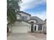 Charming two-story home featuring a two-car garage and well-maintained landscaping at 56 W Holstein Trl, San Tan Valley, AZ 85143