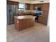 A modern kitchen featuring stainless steel appliances and a convenient center island at 56 W Holstein Trl, San Tan Valley, AZ 85143