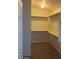 Empty walk in closet with built-in shelves at 56 W Holstein Trl, San Tan Valley, AZ 85143