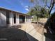 The backyard features a walkway and large trees, perfect for outdoor activities and enjoying nature at 601 W 15Th St, Tempe, AZ 85281
