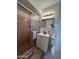 Pink themed bathroom with frosted glass sliding door shower, white vanity, sink, and toilet at 601 W 15Th St, Tempe, AZ 85281