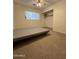 Bedroom showcasing a bedframe, ceiling fan, window with blinds, and closet in a neutral setting at 601 W 15Th St, Tempe, AZ 85281