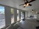 Large room showcasing concrete flooring, windows that let in natural light, and a ceiling fan at 601 W 15Th St, Tempe, AZ 85281
