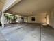 Interior of the covered carport showcases a protected parking space with entry to the house at 601 W 15Th St, Tempe, AZ 85281