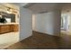 Hallway showing both tiled and wood flooring, offering a transition into other rooms at 601 W 15Th St, Tempe, AZ 85281