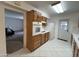Well-lit kitchen with a built-in oven, white appliances, and door to the backyard at 601 W 15Th St, Tempe, AZ 85281