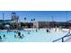 Community swimming pool showcasing families enjoying water activities under a clear blue sky at 601 W 15Th St, Tempe, AZ 85281