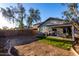 Wide backyard with a covered patio, ideal for relaxing and entertaining at 6331 W Winslow Ave, Phoenix, AZ 85043