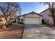 Inviting single-story home featuring a two-car garage and established desert landscaping at 6331 W Winslow Ave, Phoenix, AZ 85043
