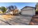 Well-maintained home featuring a two-car garage, desert landscaping, and a lengthy driveway at 6331 W Winslow Ave, Phoenix, AZ 85043