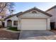 Charming single-story home with a two-car garage and well-maintained front yard at 6331 W Winslow Ave, Phoenix, AZ 85043