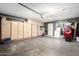 Spacious garage with built-in storage cabinets and laundry appliances, providing ample room for vehicles and projects at 6331 W Winslow Ave, Phoenix, AZ 85043