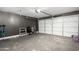 Garage featuring a light grey wall and a large white door at 6331 W Winslow Ave, Phoenix, AZ 85043