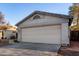 Spacious two-car garage with an attractive panel door and well-kept driveway at 6331 W Winslow Ave, Phoenix, AZ 85043