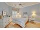 Cozy bedroom features a ceiling fan, natural light from the shuttered window, and hardwood flooring at 6730 E Hermosa Vista Dr # 38, Mesa, AZ 85215