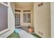 Inviting front entry with decorative potted plants and artificial turf at 6730 E Hermosa Vista Dr # 38, Mesa, AZ 85215