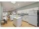 Bright and airy kitchen featuring a skylight and center island at 6730 E Hermosa Vista Dr # 38, Mesa, AZ 85215