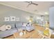 Open living room with stylish decor, hardwood floors, and bar seating at 6730 E Hermosa Vista Dr # 38, Mesa, AZ 85215