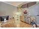 Functional home office space with a modern desk setup, wooden cabinet, and a stylish surfboard decor at 6730 E Hermosa Vista Dr # 38, Mesa, AZ 85215