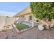 Private covered patio with synthetic grass and desert landscaping at 6730 E Hermosa Vista Dr # 38, Mesa, AZ 85215