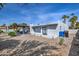 Backyard featuring a gazebo with blue seating, grey concrete, and minimal landscaping at 6801 E Sheena Dr, Scottsdale, AZ 85254