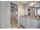 Bathroom featuring a double vanity, modern lighting, and neutral walls at 6801 E Sheena Dr, Scottsdale, AZ 85254
