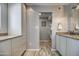 Bright bathroom showcasing double sinks with granite countertops, white cabinets and modern lighting at 6801 E Sheena Dr, Scottsdale, AZ 85254
