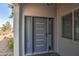 Stylish front door with modern design elements and sidelights for added natural light at 6801 E Sheena Dr, Scottsdale, AZ 85254
