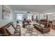 Open-concept living room with multiple seating areas, modern decor, and ample natural light at 6801 E Sheena Dr, Scottsdale, AZ 85254