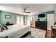 Large main bedroom showcasing a modern ceiling fan, access to a private bathroom, and lots of light at 6801 E Sheena Dr, Scottsdale, AZ 85254