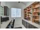 Bright office with custom cabinetry and shelving, offering ample storage and workspace at 6801 E Sheena Dr, Scottsdale, AZ 85254