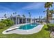 Backyard pool with diving board, surrounded by lush landscaping and palm trees at 6801 E Sheena Dr, Scottsdale, AZ 85254