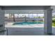 View of the sparkling in-ground pool from the covered patio, perfect for summertime fun and relaxation at 6801 E Sheena Dr, Scottsdale, AZ 85254