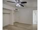 Bedroom features wood flooring, white walls and ample closet space at 7135 E Baywood Ave, Mesa, AZ 85208