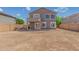 Exterior of home featuring a back patio and large, open backyard space at 7230 N 70Th Ln, Glendale, AZ 85303